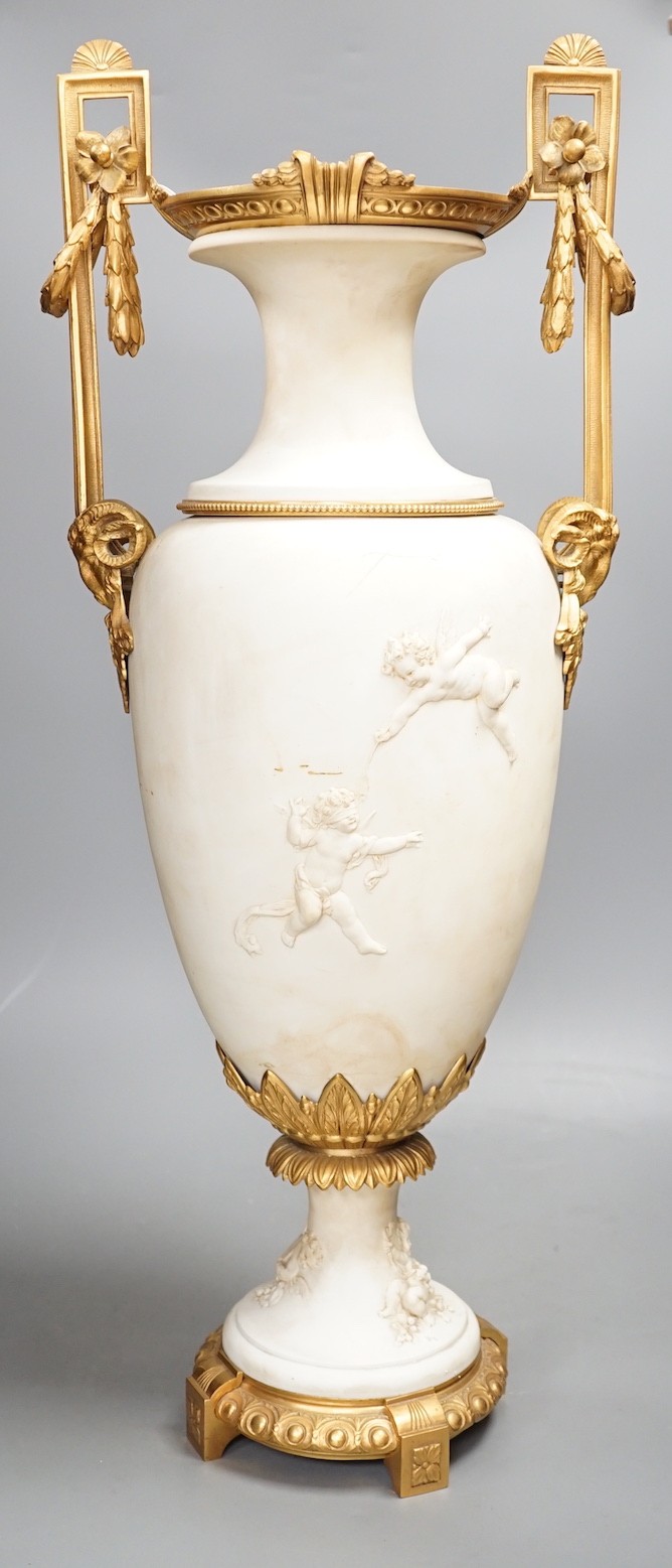 A large Louis XVI style ormolu mounted biscuit porcelain urn - 63cm tall